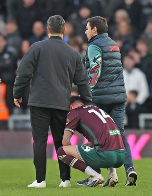 140226 - Derby County v Swansea City - Sky Bet Championship - Swansea manager Vitor Matos comforts Josh Tymon of Swansea at the end of the match