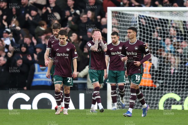 140226 - Derby County v Swansea City - Sky Bet Championship - Josh Tymon of Swansea City dejected with team mates after Derby County score their second goal 