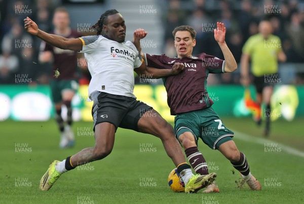 140226 - Derby County v Swansea City - Sky Bet Championship - Manuel Benson of Swansea and David Ozoh of Derby clash in the 2nd half