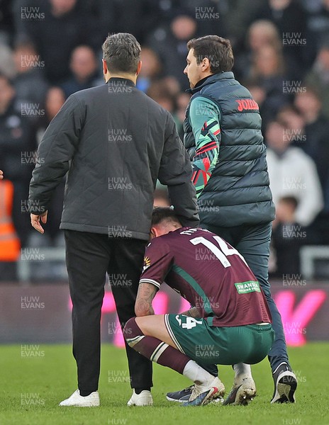 140226 - Derby County v Swansea City - Sky Bet Championship - Swansea manager Vitor Matos comforts Josh Tymon of Swansea at the end of the match