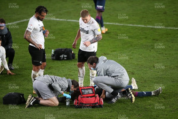 161220 - Derby County v Swansea City - SkyBet Championship - Andre Ayew of Swansea City is seen to by medical staff