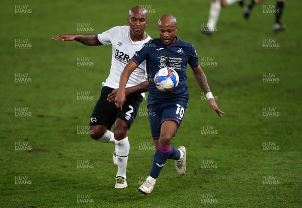 161220 - Derby County v Swansea City - SkyBet Championship - Andre Ayew of Swansea City is challenged by Andre Wisdom of Derby County