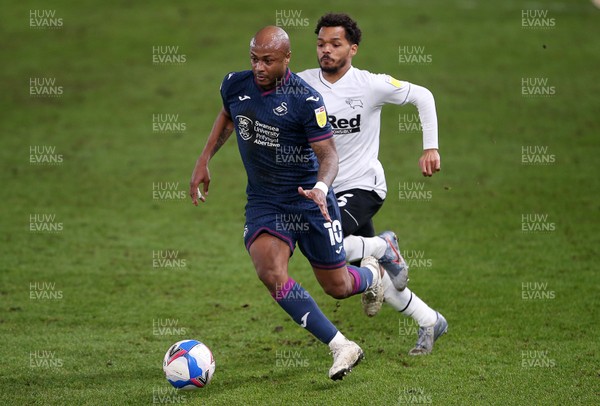 161220 - Derby County v Swansea City - SkyBet Championship - Andre Ayew of Swansea City is challenged by Duane Holmes of Derby County