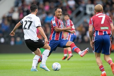 290826 - Derby County v Swansea City - Sky Bet Championship - Adam Idah of Swansea City is challenged by Lewis Travis of Derby