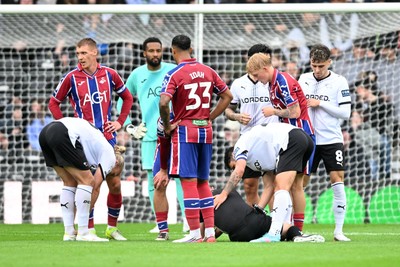 290826 - Derby County v Swansea City - Sky Bet Championship - Referee, David Webb is struck in the face by the ball