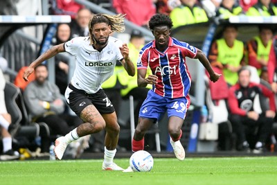 290826 - Derby County v Swansea City - Sky Bet Championship - Moussa Yeo of Swansea City is challenged by Dion Sanderson of Derby
