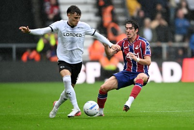 290826 - Derby County v Swansea City - Sky Bet Championship - Josh Key of Swansea City is challenged by Bobby Clark of Derby