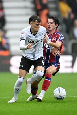 290826 - Derby County v Swansea City - Sky Bet Championship - Josh Key of Swansea City is challenged by Bobby Clark of Derby