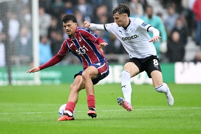 290826 - Derby County v Swansea City - Sky Bet Championship - Filip Lissah of Swansea City is challenged by Bobby Clark of Derby
