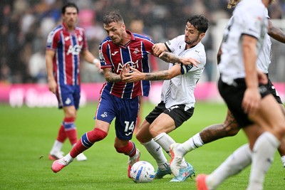 290826 - Derby County v Swansea City - Sky Bet Championship - Josh Tymon of Swansea City is challenged by Bobby Clark of Derby