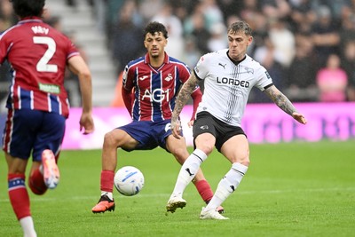 290826 - Derby County v Swansea City - Sky Bet Championship - Filip Lissah of Swansea City is challenged by Alex Mowatt of Derby