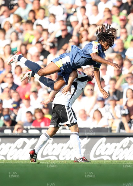 20.09.08...Derby County v Cardiff City, Coca Cola Championship -  Cardiff's Miguel Comminges flies over Derby's Emanuel Villa   