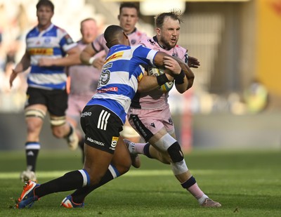 300525 - DHL Stormers v Cardiff Rugby - United Rugby Championship Quarter Final - Ioan Lloyd of Cardiff Rugby tackled by Damian Willemse of the Stormers