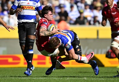 241026 - DHL Stormers v Scarlets - United Rugby Championship Quarter Final - Joe Roberts of the Scarlets tackled by Evan Roos of the Stormers