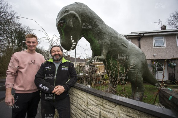 030319 - Picture shows a 15 ft tall dinosaur in the front garden of Jeremy Adams, in Cwmbran, South Wales The dinosaur is to raise money for diabetes charity JDRF - Cory Thomas who helped Jeremy Adam get the dinosaur to his home