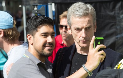 170714 - Doctor Who Filming, Cardiff - Doctor Who actor Peter Capaldi poses for a selfie with a fan after  filming in Cardiff City centre 