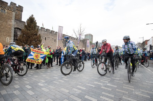 120222 - Wakes v Scotland 2022 Six Nations - Riders arrive at Cardiff Castle after participating in the Doddie Cup 500 cycle ride from Murrayfield which will deliver the match ball to the Principality Stadium for the Wales v Scotland game, and raise funds and awareness for My Name'5 Doddie Foundation