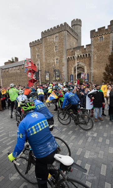 120222 - Wakes v Scotland 2022 Six Nations - Riders arrive at Cardiff Castle after participating in the Doddie Cup 500 cycle ride from Murrayfield which will deliver the match ball to the Principality Stadium for the Wales v Scotland game, and raise funds and awareness for My Name'5 Doddie Foundation