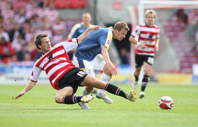 16.08.08...Doncaster Rovers v Cardiff City, Coca Cola Championship. -  Cardiff's Paul Parry is tackled by Doncaster's Gareth Taylor   