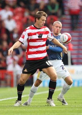 16.08.08...Doncaster Rovers v Cardiff City, Coca Cola Championship. -  Doncaster's Gareth Taylor controls under pressure from Cardiff's Kevin McNaughton 