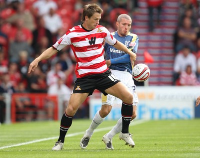 16.08.08...Doncaster Rovers v Cardiff City, Coca Cola Championship. -  Doncaster's Gareth Taylor controls under pressure from Cardiff's Kevin McNaughton 