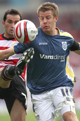 16.08.08...Doncaster Rovers v Cardiff City, Coca Cola Championship. -  Cardiff's Paul Parry is challenged by Doncaster's Sam Hird  