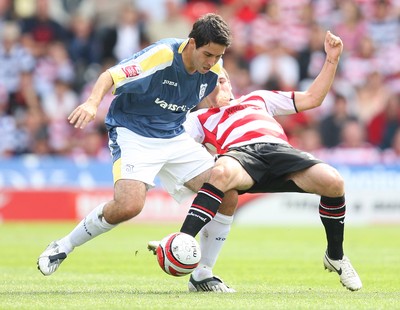 16.08.08...Doncaster Rovers v Cardiff City, Coca Cola Championship. -  Cardiff's Peter Whittingham sees off Doncaster's Lewis Guy's challenge 