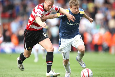 16.08.08...Doncaster Rovers v Cardiff City, Coca Cola Championship. -  Cardiff's Paul Parry holds off Doncaster's Matthew Mills  