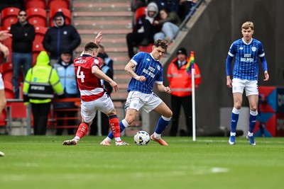 280226 - Doncaster Rovers v Cardiff City - Sky Bet League 1 - Alex Robertson wins the ball