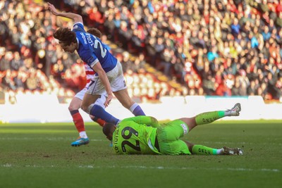 280226 - Doncaster Rovers v Cardiff City - Sky Bet League 1 - Joel Colwill is denied by Timothe Lo-Tutala 