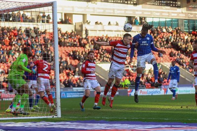 280226 - Doncaster Rovers v Cardiff City - Sky Bet League 1 - Gabriel Osho heads for goal 