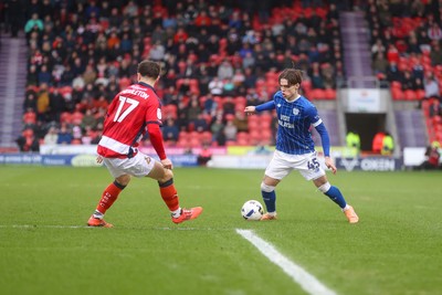 280226 - Doncaster Rovers v Cardiff City - Sky Bet League 1 - Cian Ashford looks for a way past Glenn Middleton 