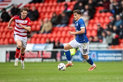 280226 - Doncaster Rovers v Cardiff City - Sky Bet League 1 - Alex Robertson on the ball 