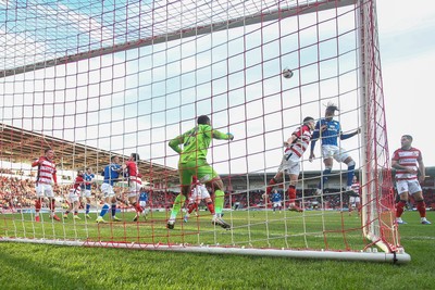 280226 - Doncaster Rovers v Cardiff City - Sky Bet League 1 - Gabriel Osho heads towards goal 