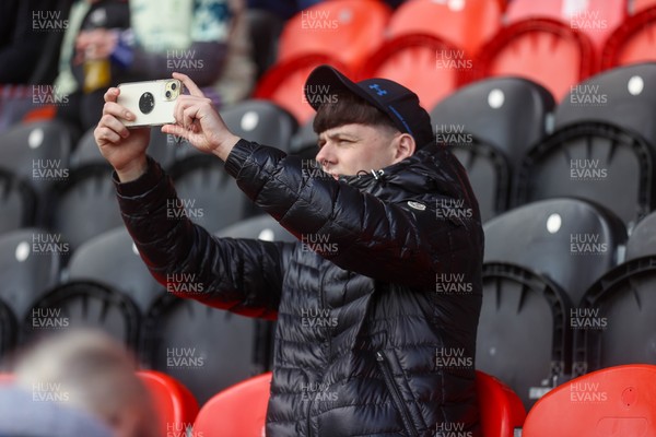 280226 - Doncaster Rovers v Cardiff City - Sky Bet League 1 - A Cardiff fan takes s picture of the stadium 