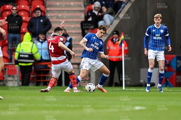 280226 - Doncaster Rovers v Cardiff City - Sky Bet League 1 - Alex Robertson wins the ball
