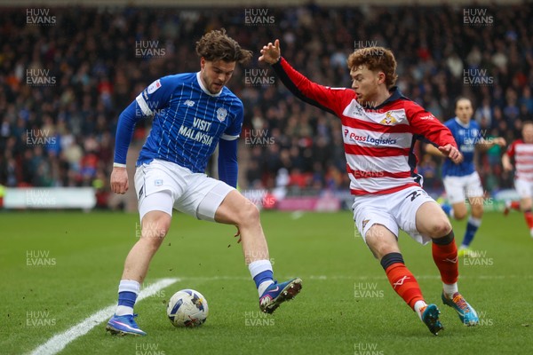 280226 - Doncaster Rovers v Cardiff City - Sky Bet League 1 - Ollie Tanner takes on the Doncaster defence 