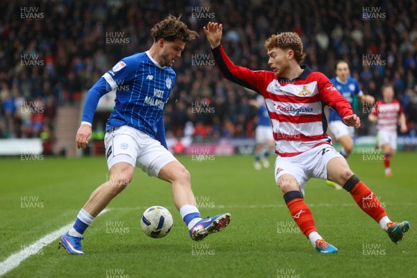 280226 - Doncaster Rovers v Cardiff City - Sky Bet League 1 - Ollie Tanner takes on the Doncaster defence 