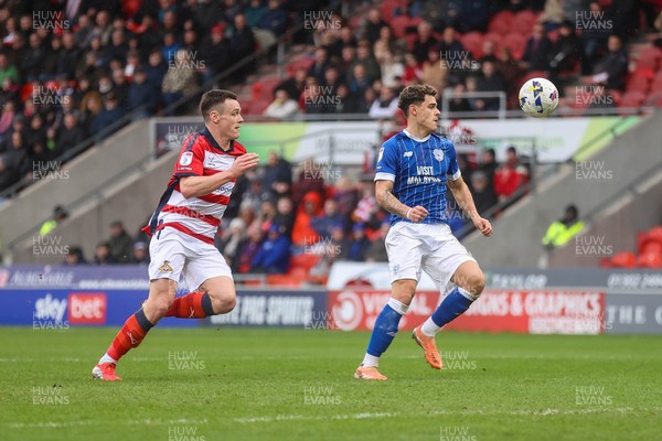 280226 - Doncaster Rovers v Cardiff City - Sky Bet League 1 - Alex Robertson pounces on the ball