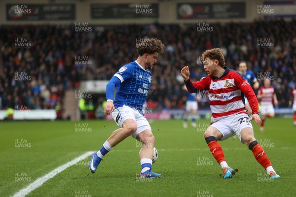 280226 - Doncaster Rovers v Cardiff City - Sky Bet League 1 - Ollie Tanner takes on Jack Senior