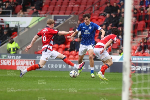 280226 - Doncaster Rovers v Cardiff City - Sky Bet League 1 - Rubin Colwill is surrounded by Doncaster defenders 