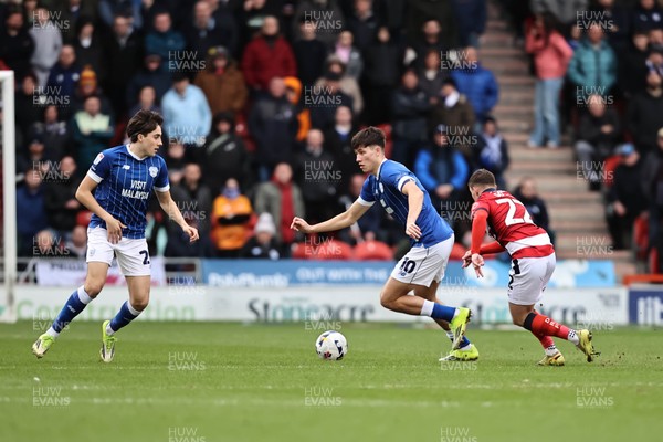 280226 - Doncaster Rovers v Cardiff City - Sky Bet League 1 - Rubin Colwill takes the ball past Robbie Gotts 