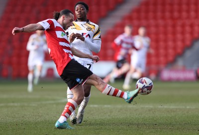 010325 - Doncaster Rovers v Newport County - Sky Bet League 2 - Bobby Kamwa of Newport and Jamie Sterry of Doncaster Rovers