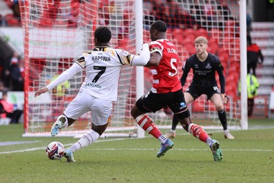 010325 - Doncaster Rovers v Newport County - Sky Bet League 2 - Bobby Kamwa of Newport and Joseph Olowu of Doncaster Rovers