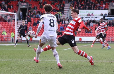 010325 - Doncaster Rovers v Newport County - Sky Bet League 2 - Josh Martin of Newport and George Broadbent of Doncaster Rovers