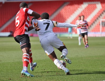 010325 - Doncaster Rovers v Newport County - Sky Bet League 2 - Bobby Kamwa of Newport and Joseph Olowu of Doncaster Rovers