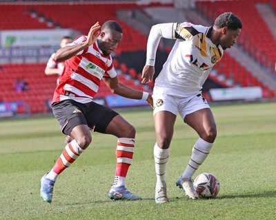 010325 - Doncaster Rovers v Newport County - Sky Bet League 2 - Bobby Kamwa of Newport and Joseph Olowu of Doncaster Rovers