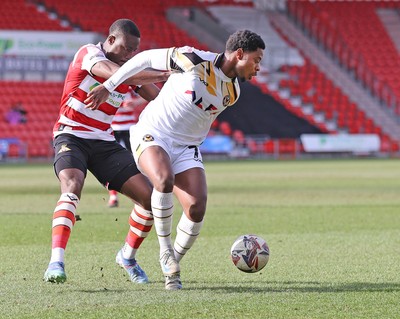 010325 - Doncaster Rovers v Newport County - Sky Bet League 2 - Bobby Kamwa of Newport and Joseph Olowu of Doncaster Rovers