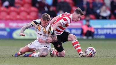 010325 - Doncaster Rovers v Newport County - Sky Bet League 2 - Kai Whitmore of Newport and Harry Clifton of Doncaster Rovers