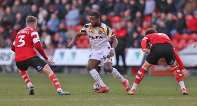 010325 - Doncaster Rovers v Newport County - Sky Bet League 2 - David Ajiboye of Newport and George Broadbent of Doncaster Rovers and James Maxwell of Doncaster Rovers